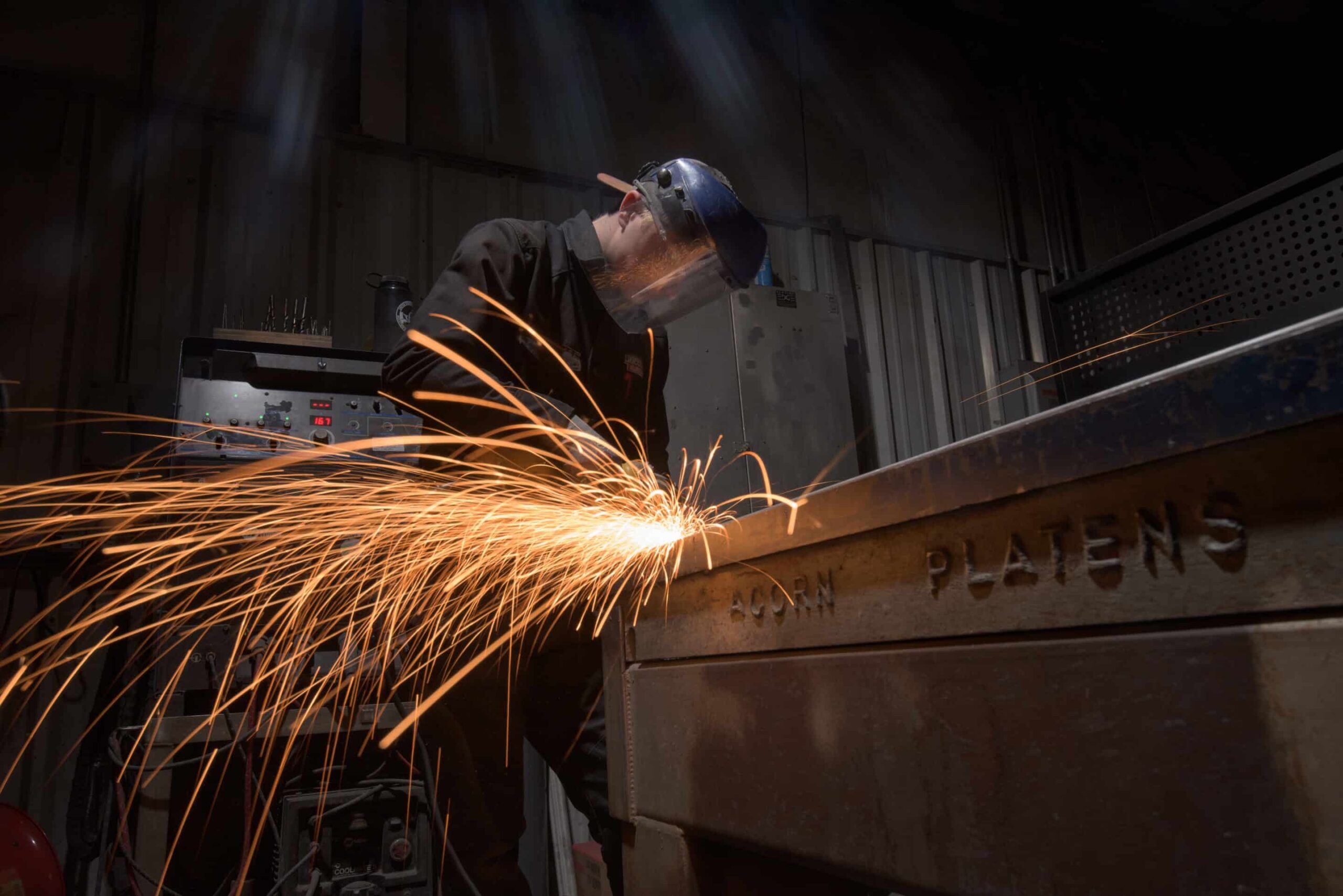 Finishing work being done by team member - Custom Metal Fabrication - Leading Edge Manufacturing